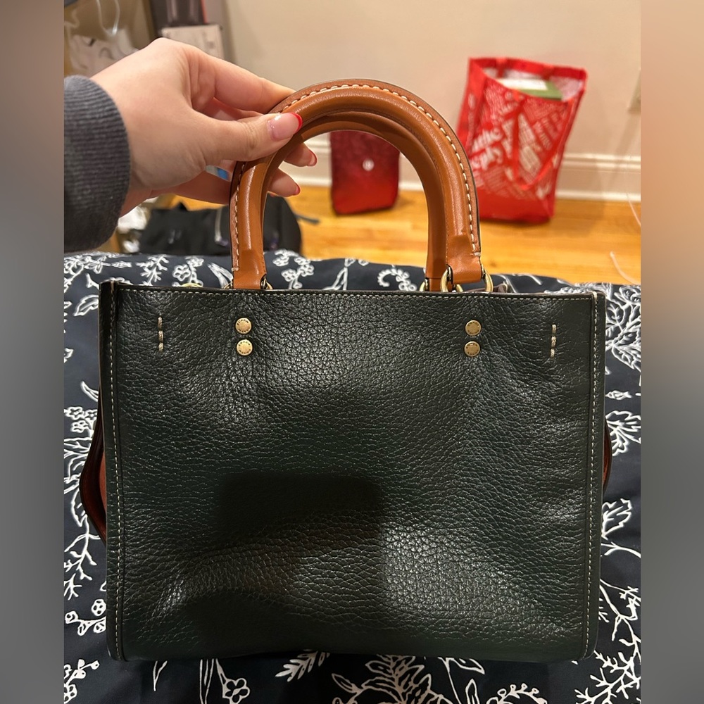 Gently used coach rogue bag. Very capacious with different compartments.